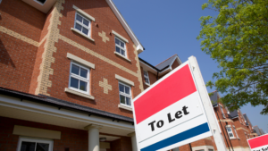 Image of a house and a to let sign